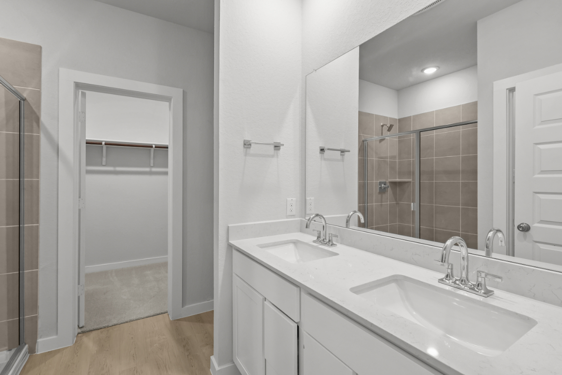 A bathroom with a glass shower.