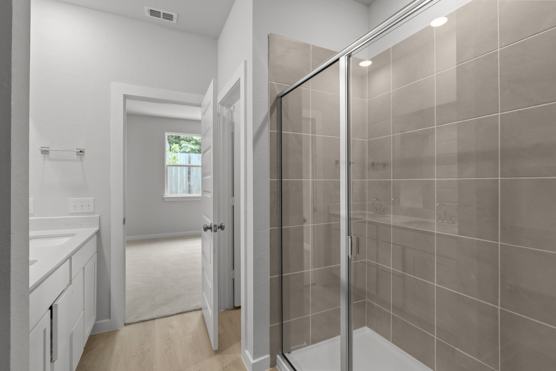 A bathroom with a glass shower.