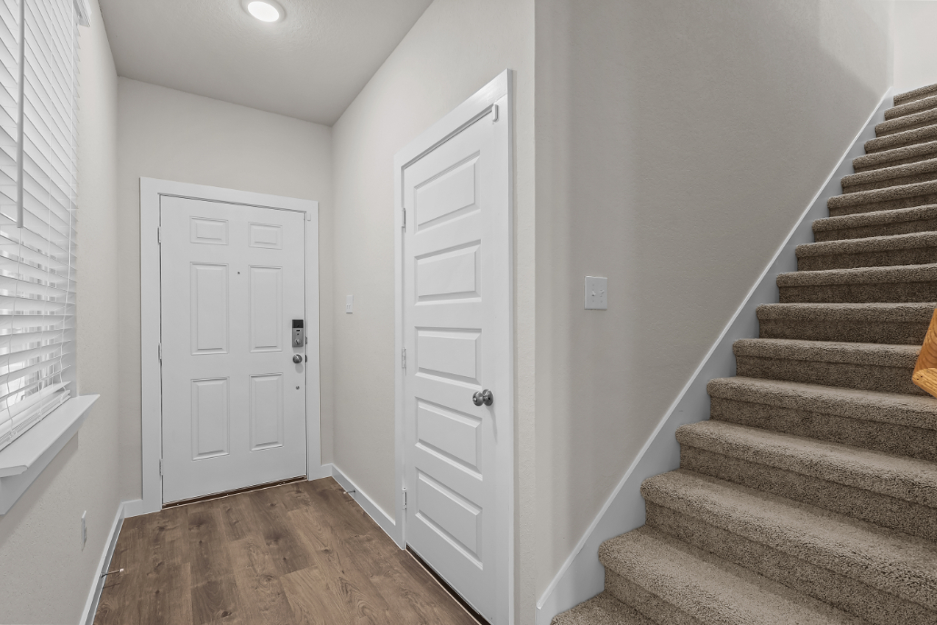 A staircase leading to a door.