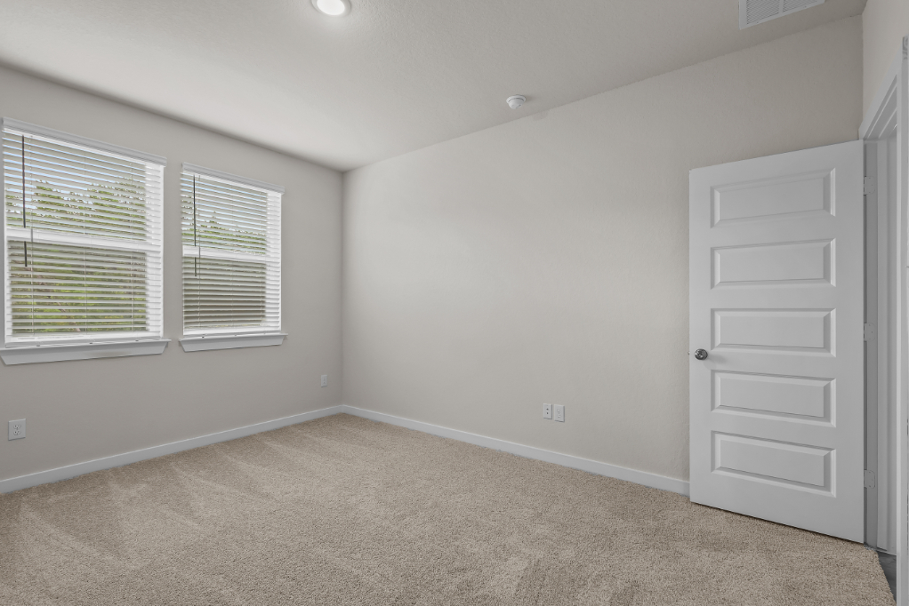A room with a white door and a white door.