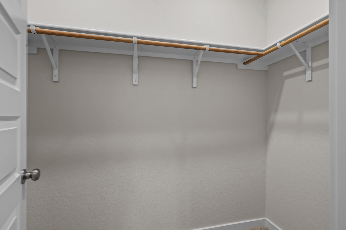 A metal bar on a white wall.