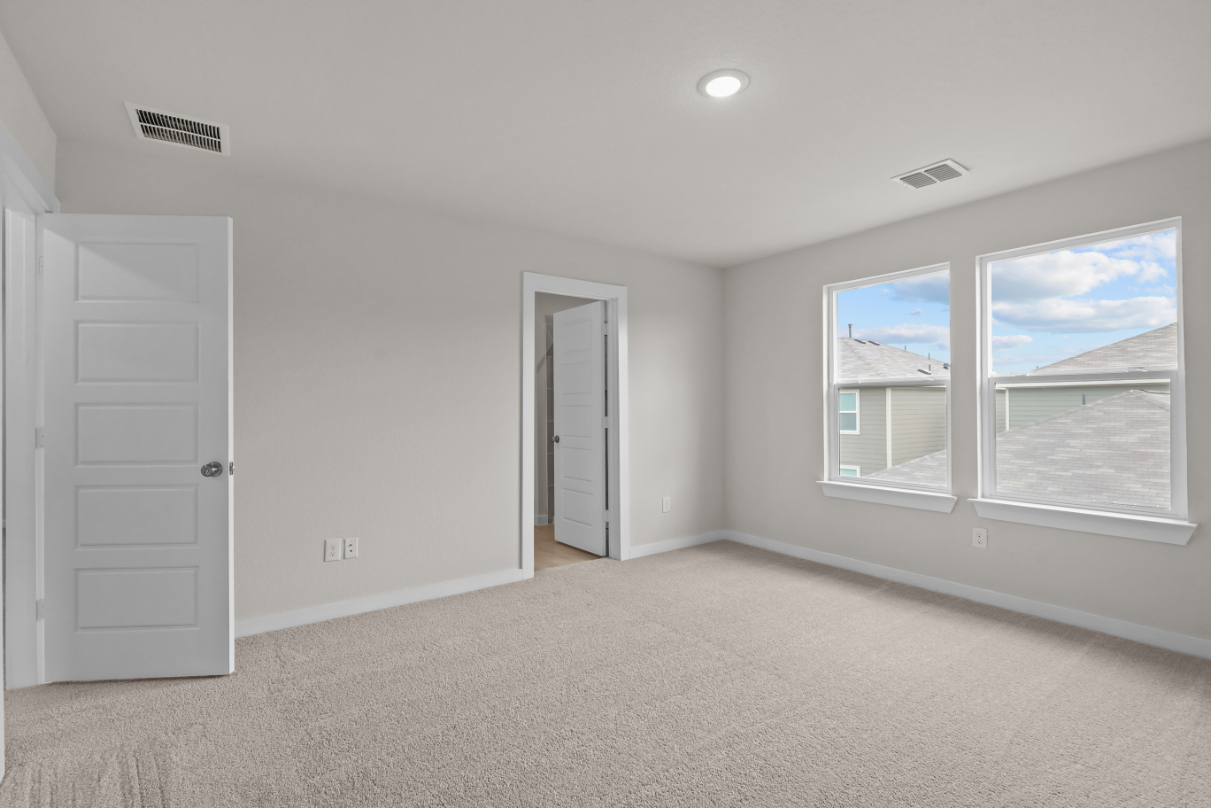 A room with a window and a door.