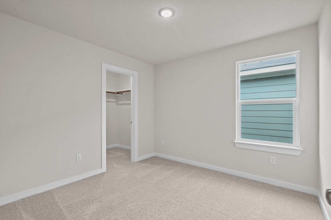 A room with a window and a door.