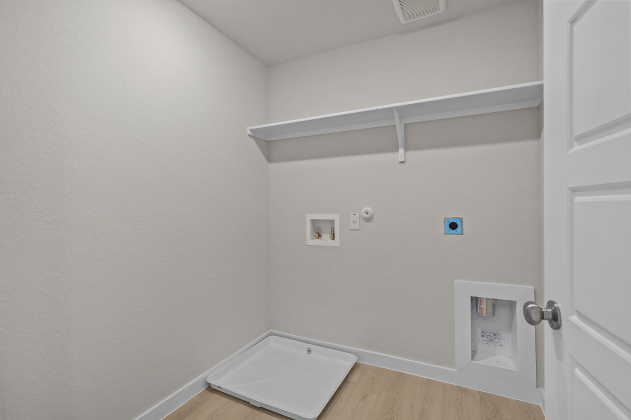 A white wall with a white door and a white door.