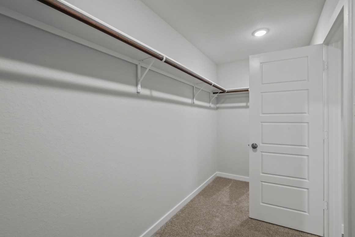 A white room with a white door.