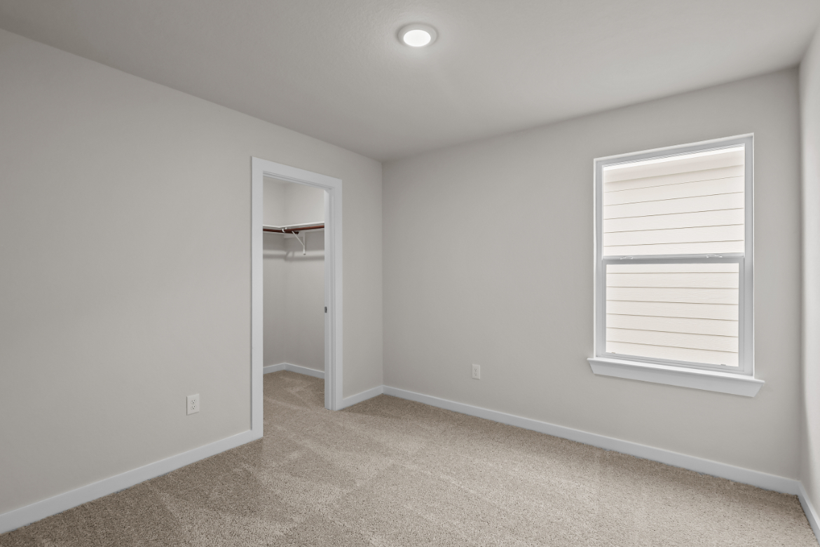 A room with a door and a window.