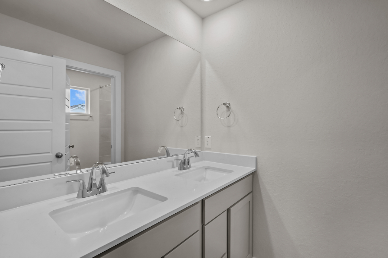 A bathroom with two sinks.