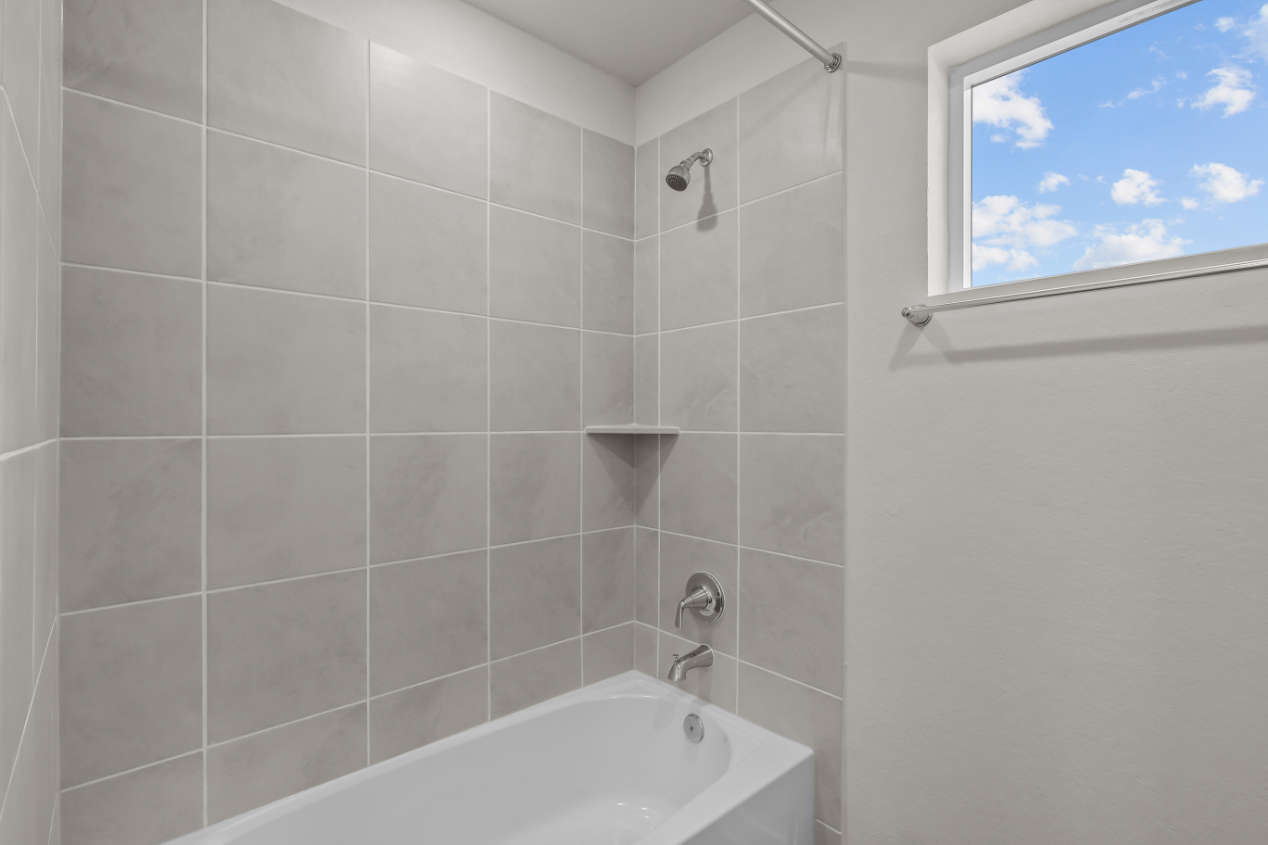 A bathtub and a window.