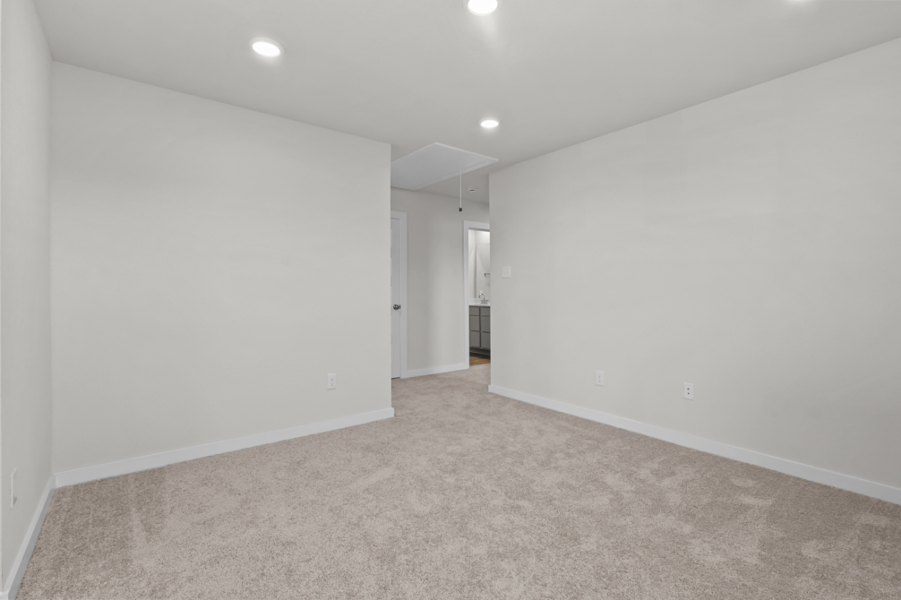 A hallway with white walls.