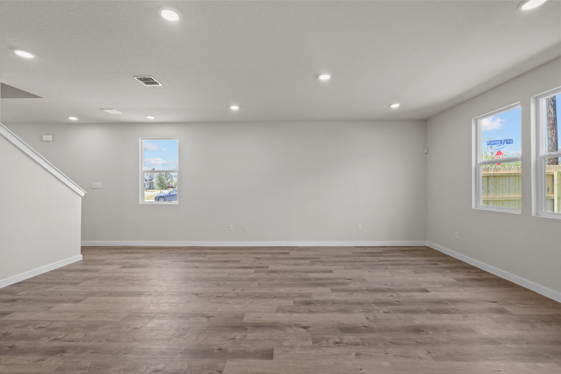 A room with a wood floor and a wood floor.