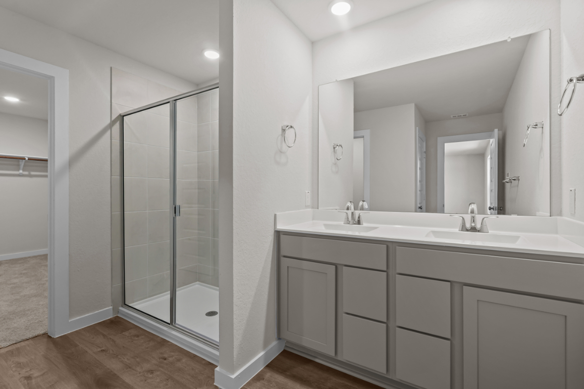A bathroom with a glass shower.