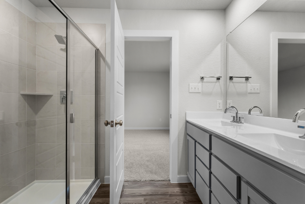 A bathroom with a glass shower.