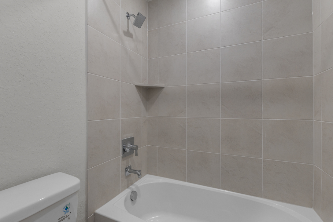 A bathtub in a bathroom.