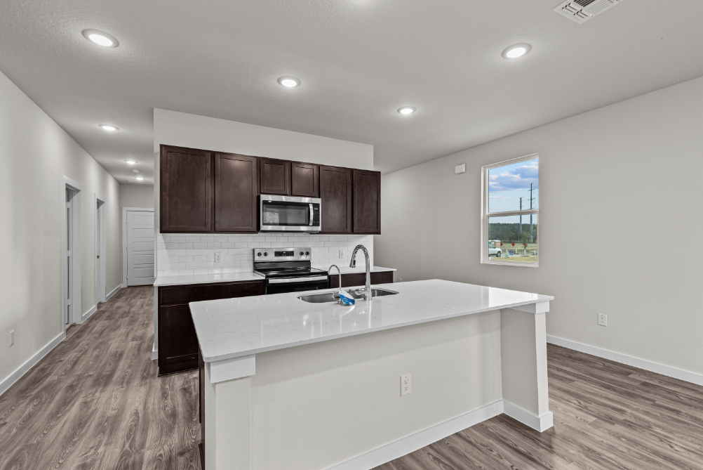 A kitchen with a white countertop.