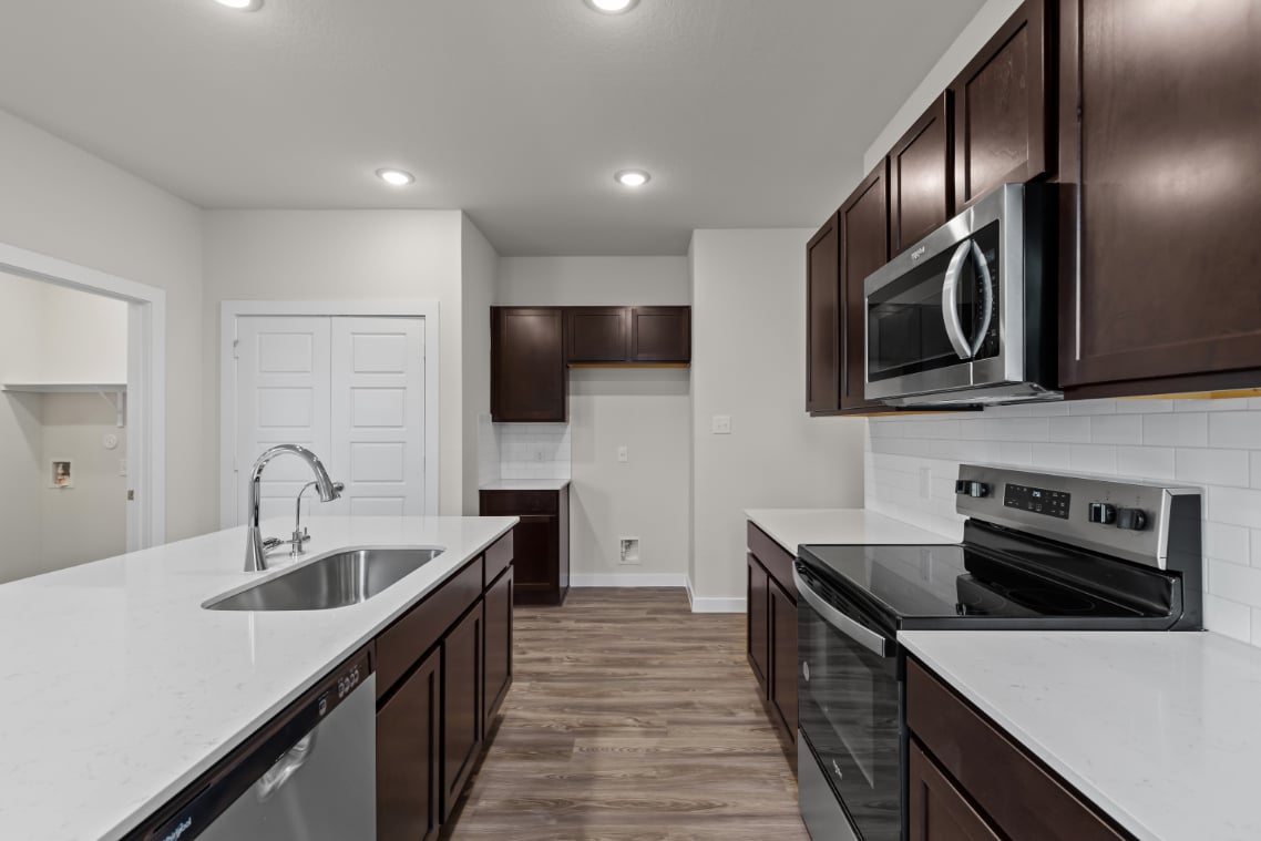 A kitchen with black appliances.