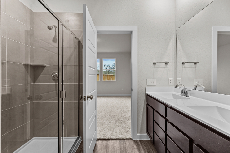 A bathroom with a glass shower.