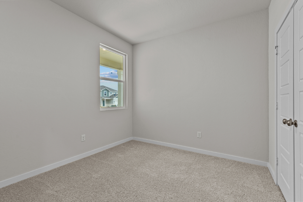 A room with a door and a window.