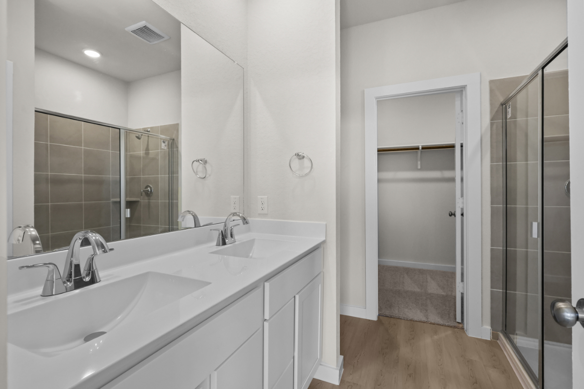 A bathroom with a glass shower.