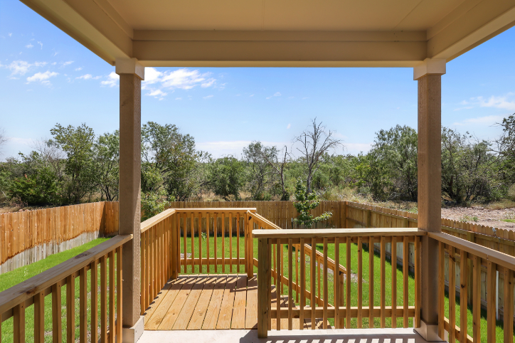 A wooden deck with a railing.