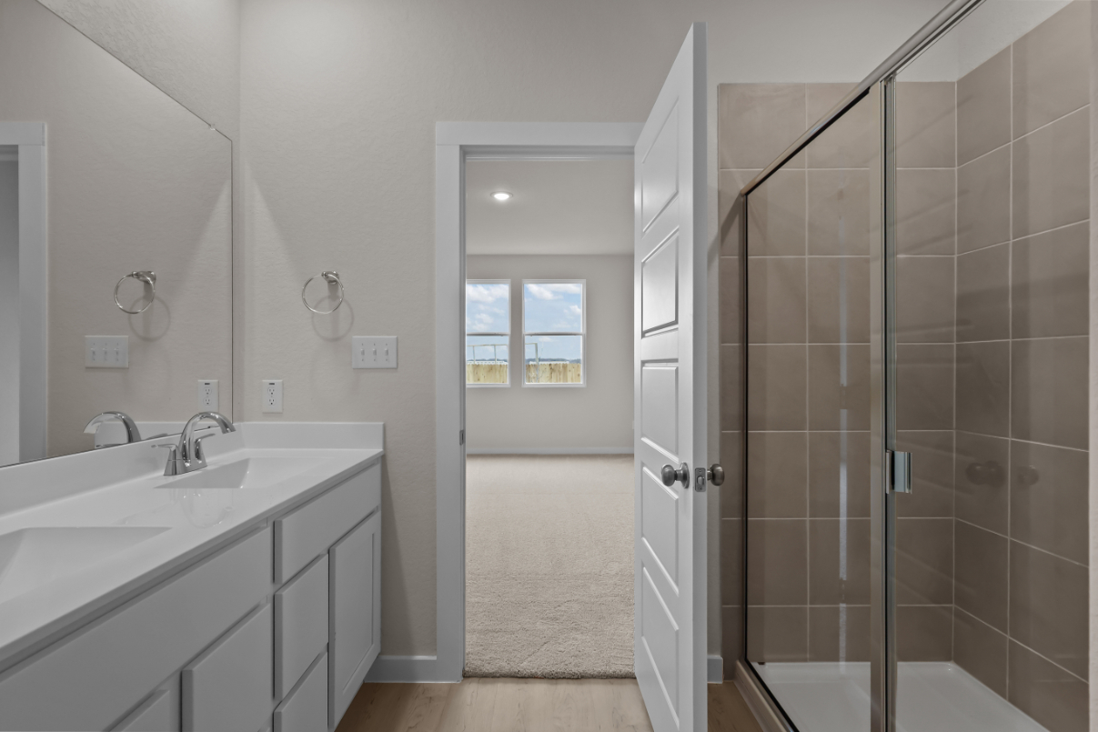 A bathroom with a glass shower.