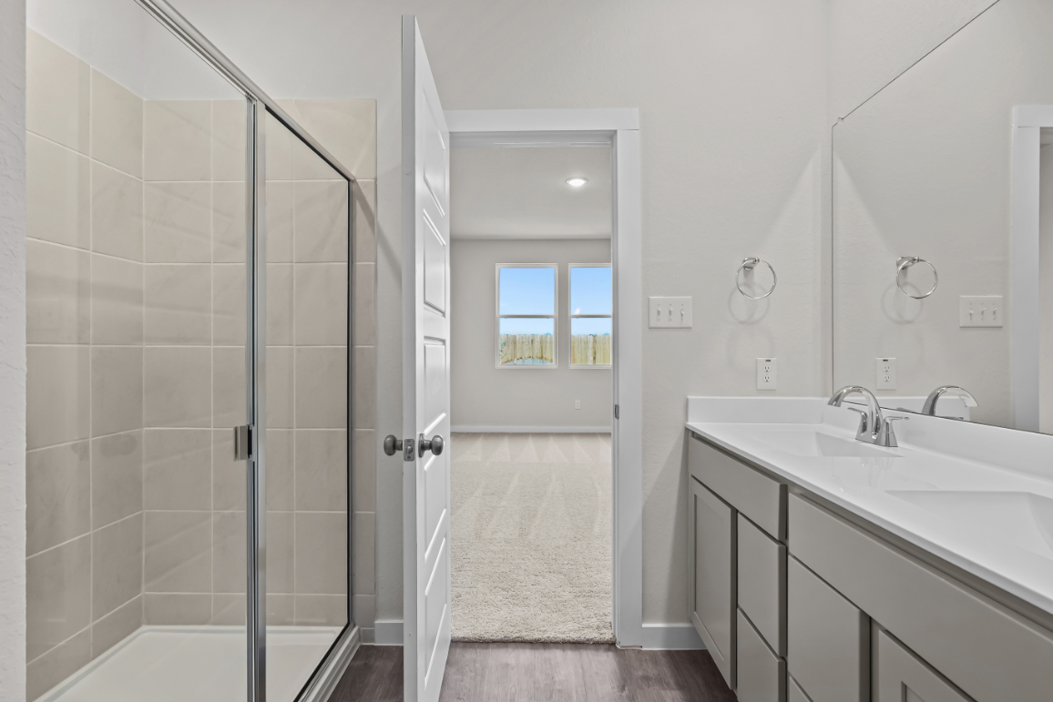 A bathroom with a glass shower.