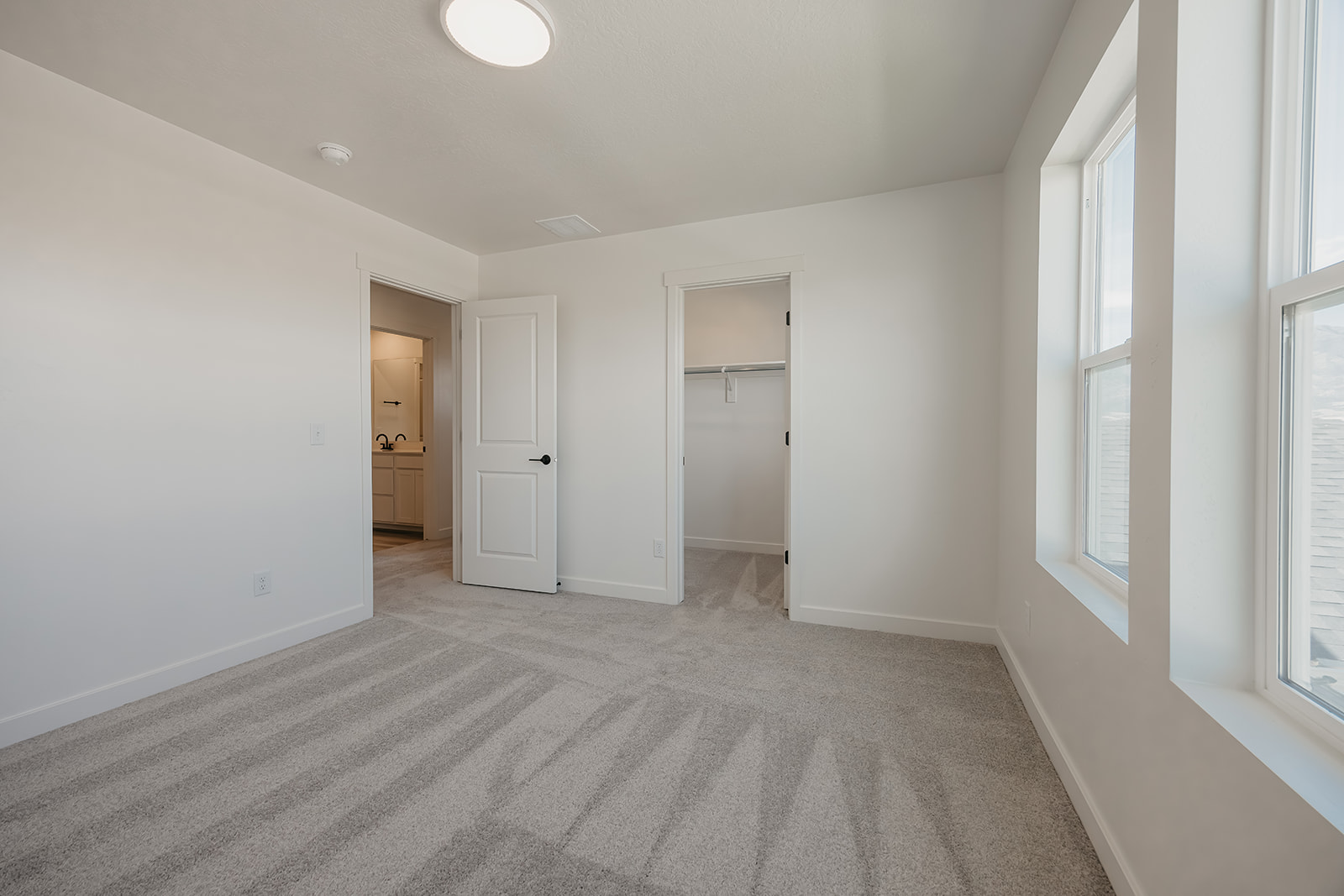 A long hallway with white walls.