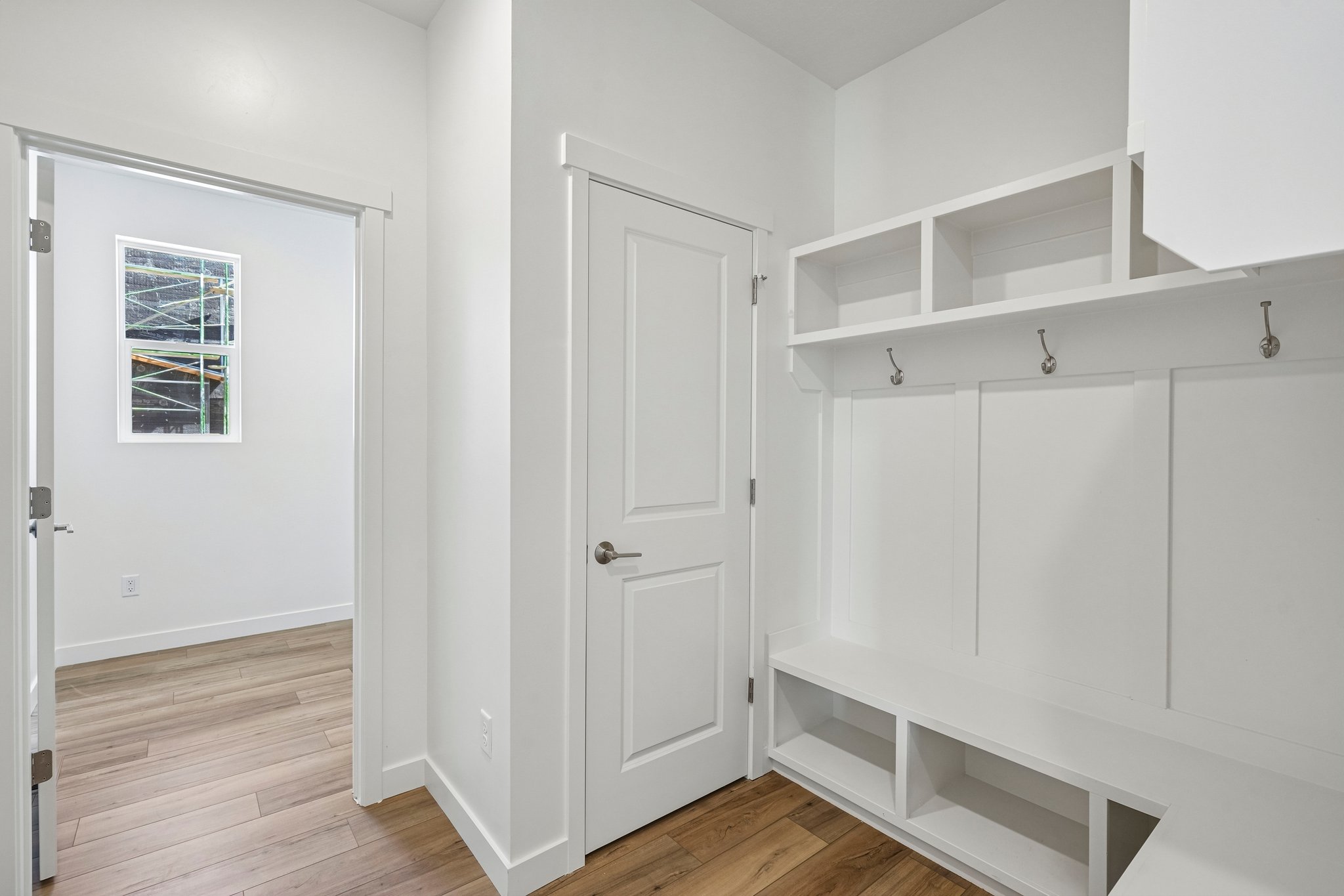 A white room with white cabinets.
