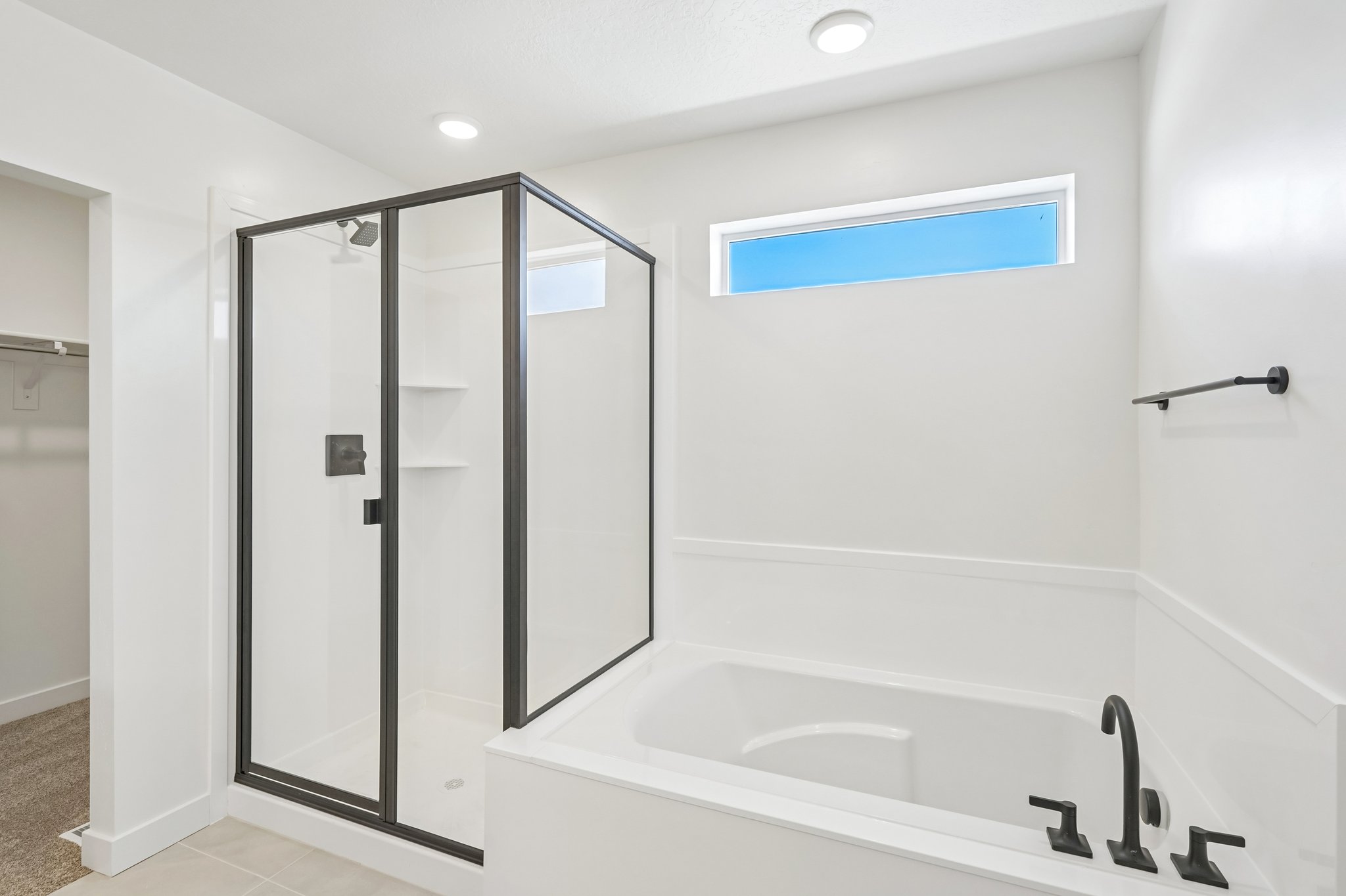 A bathroom with a glass shower.
