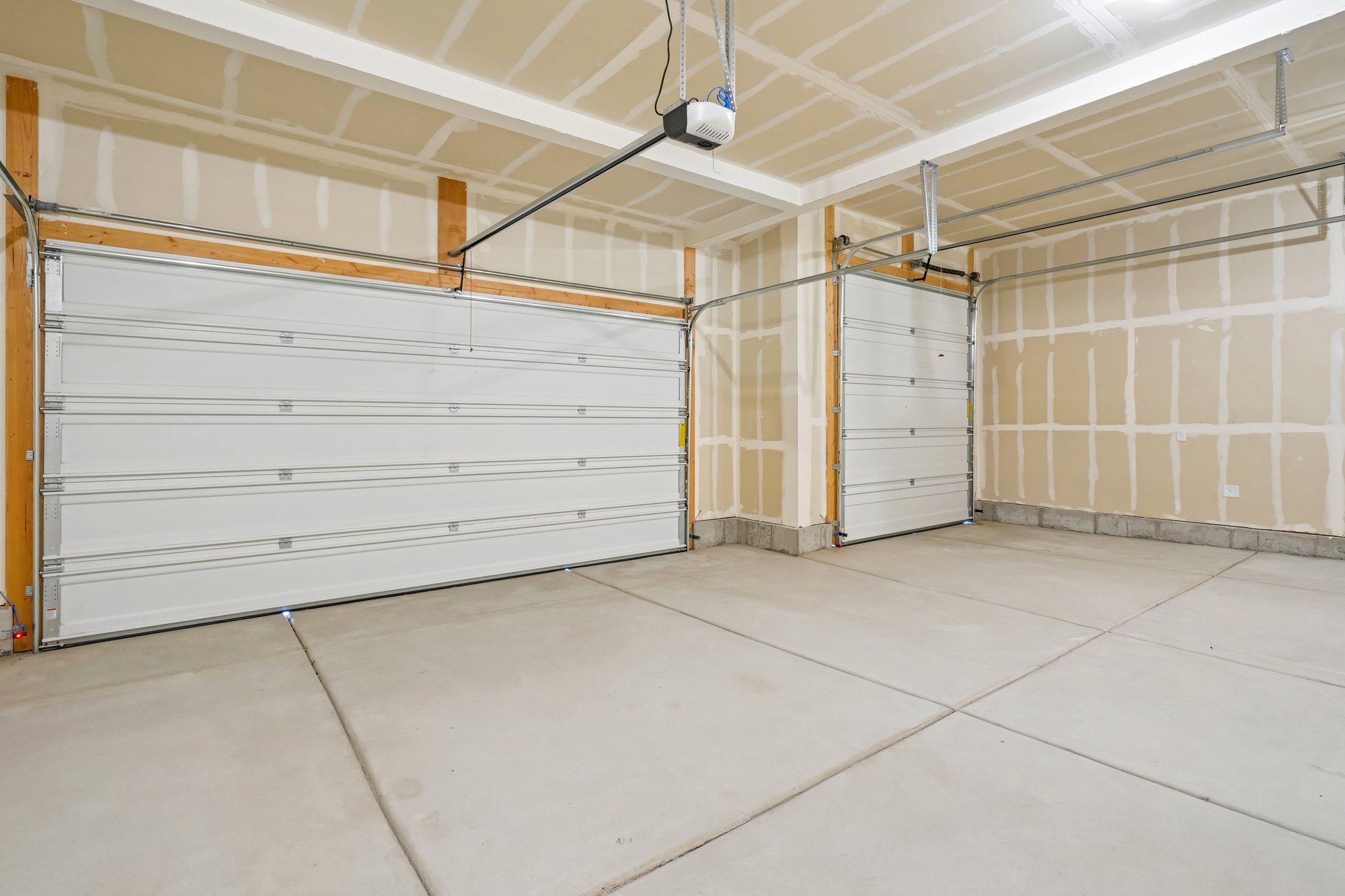 A room with white walls and a wood floor.