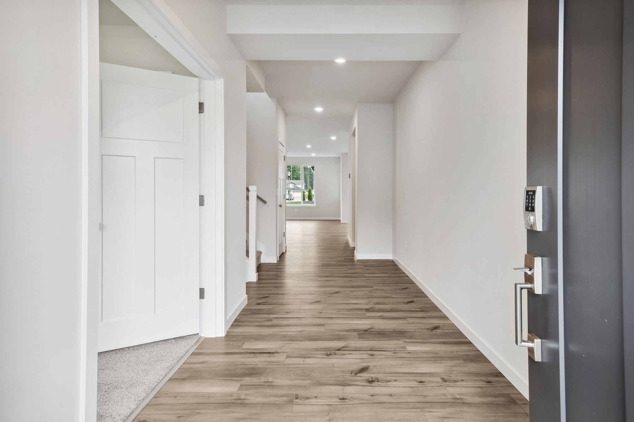 A hallway with white doors.