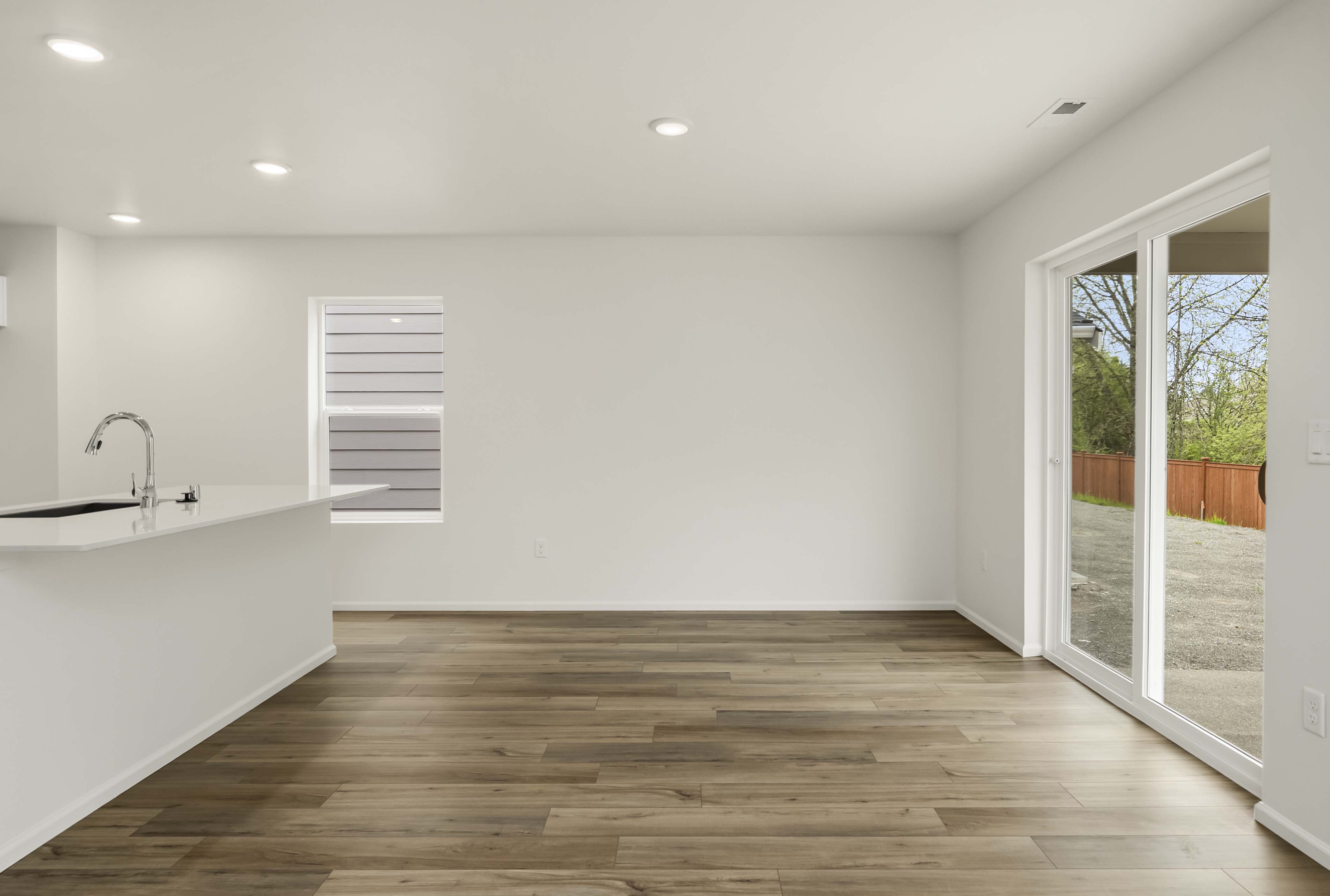 A bathroom with a wood floor.