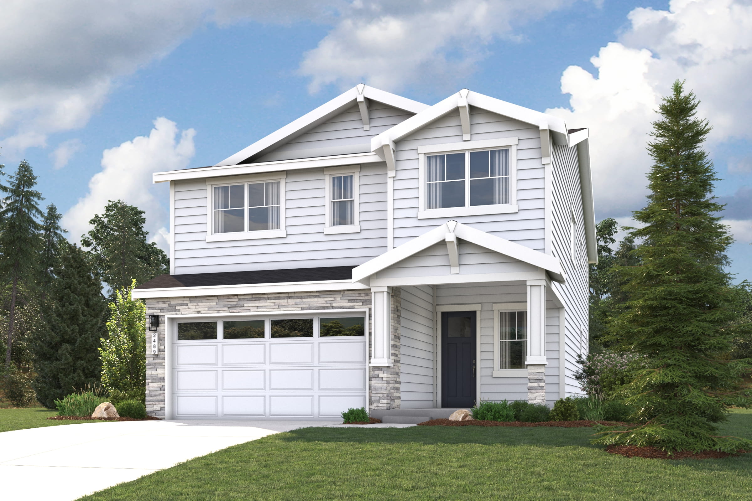 A white house with a garage.