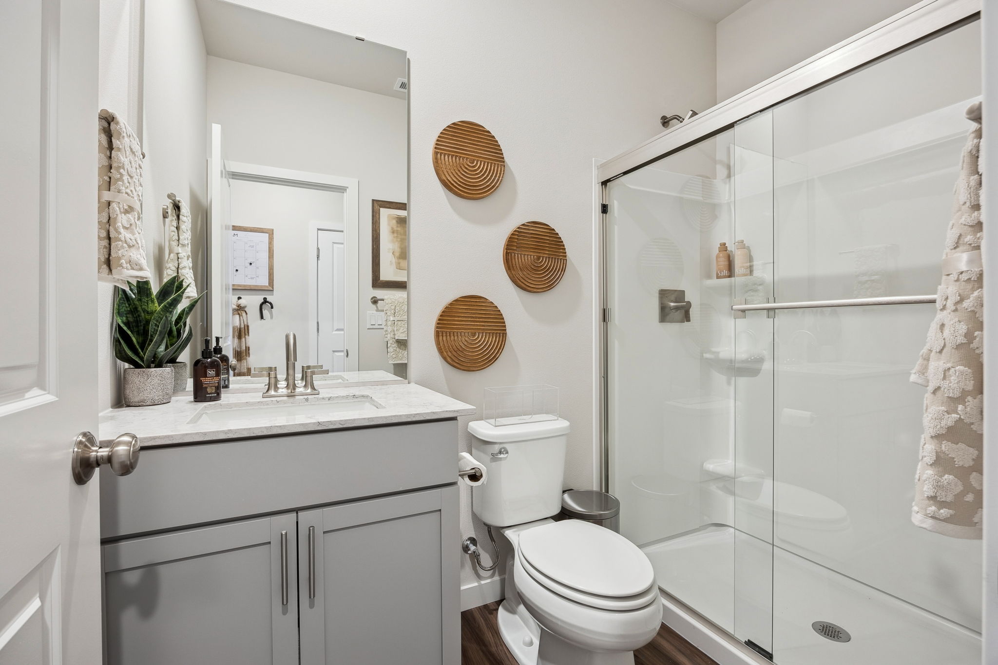 A bathroom with a glass shower.