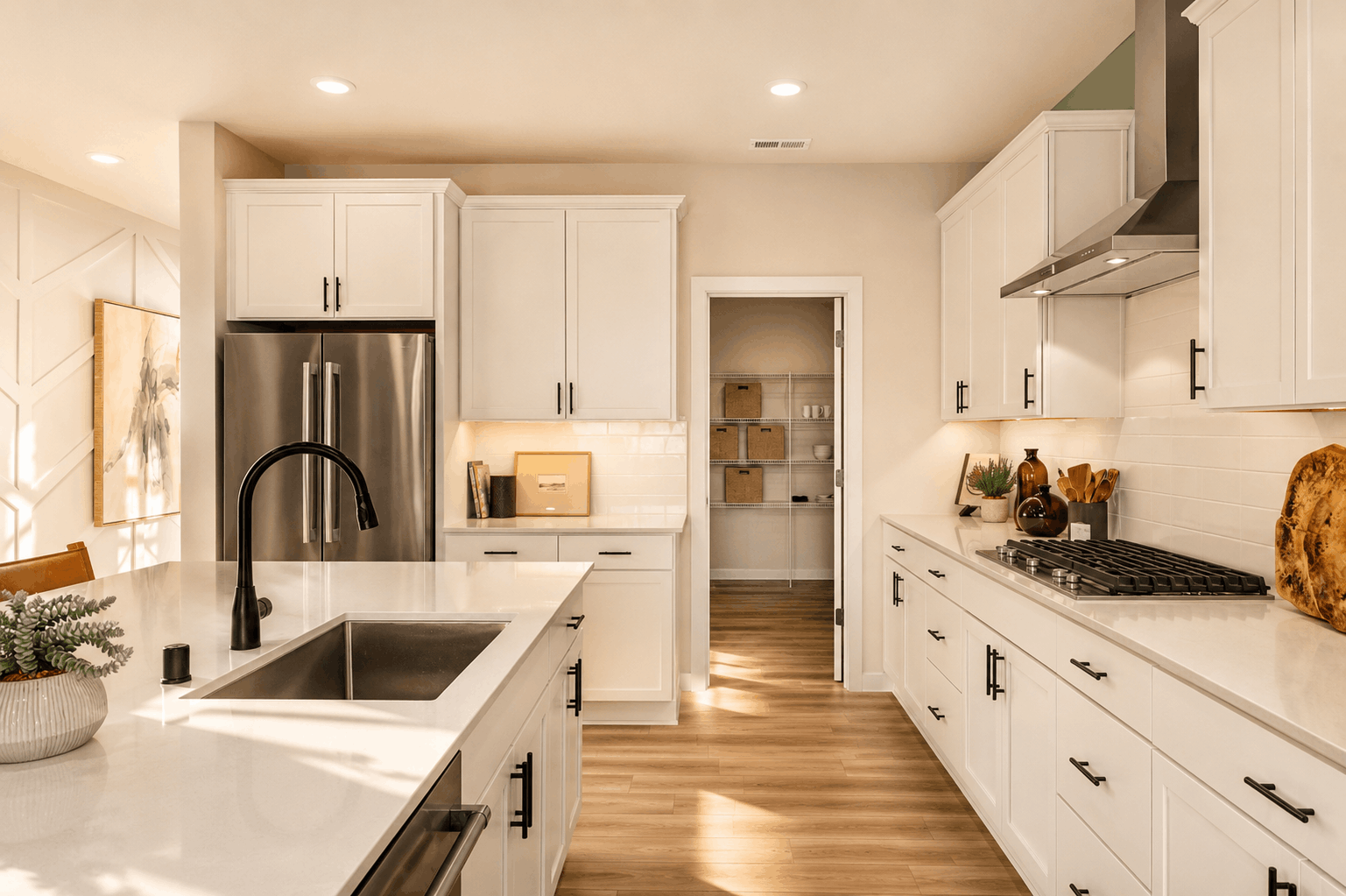 A kitchen with white cabinets.