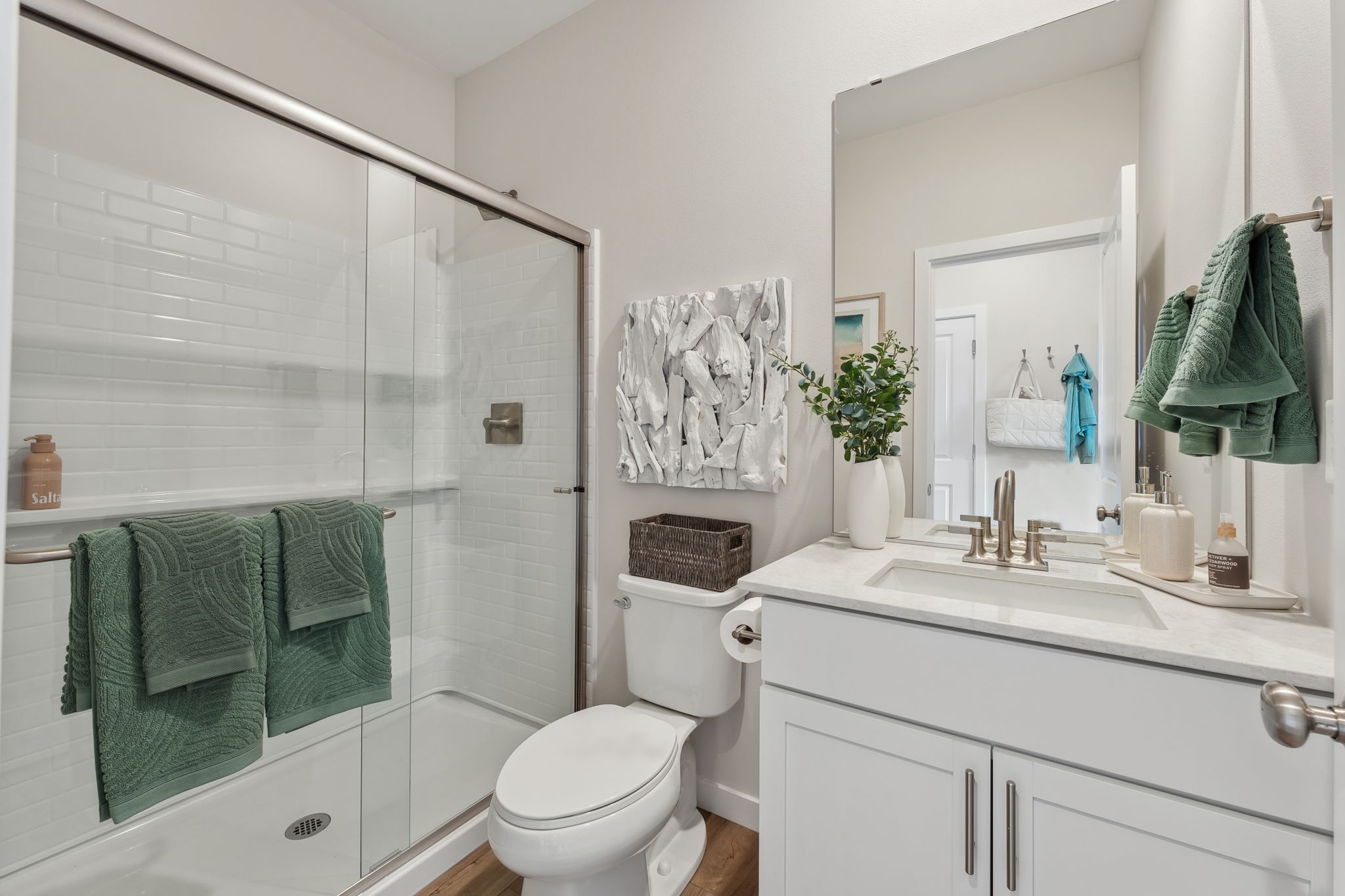 A bathroom with a glass shower.