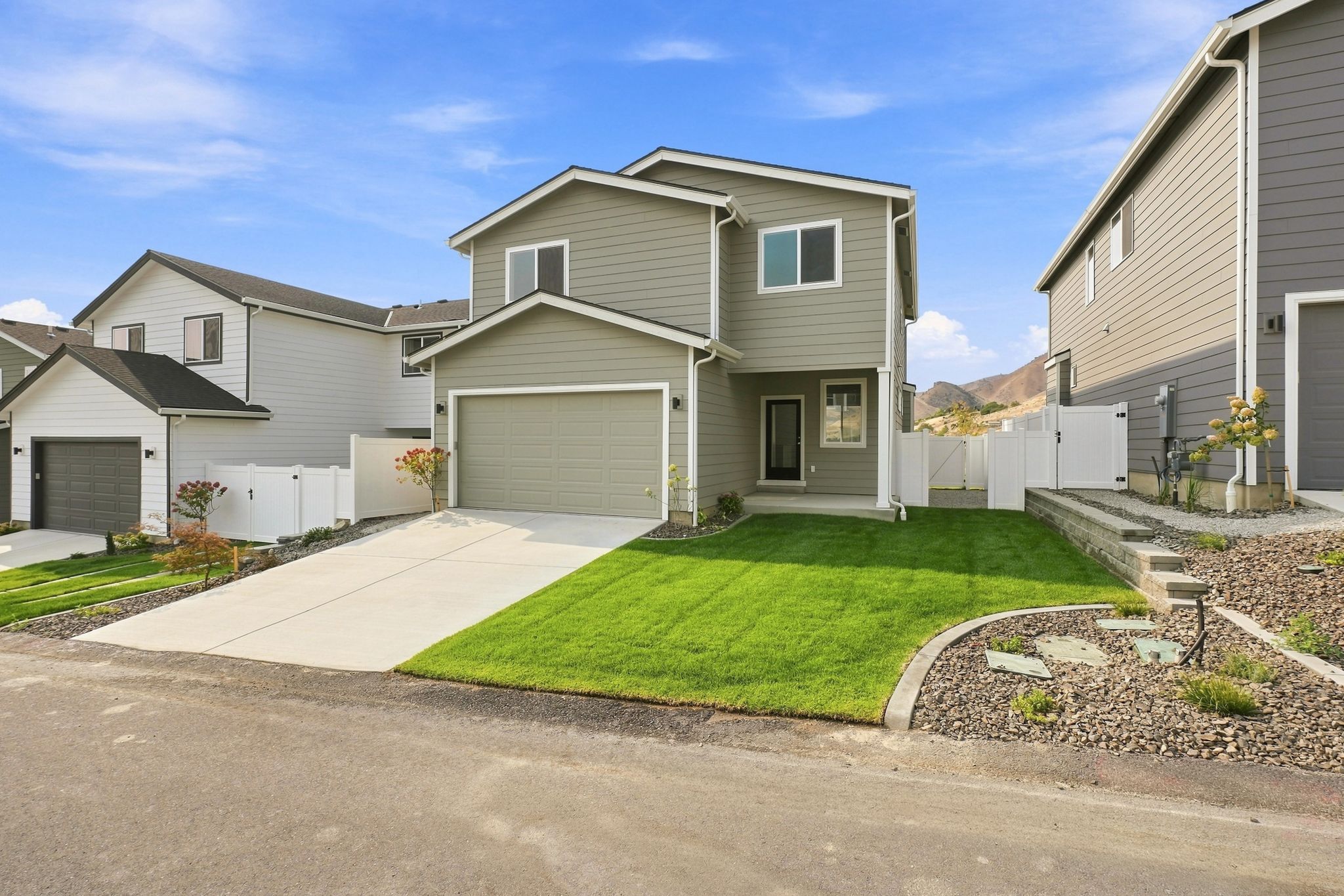 A house with a green lawn.