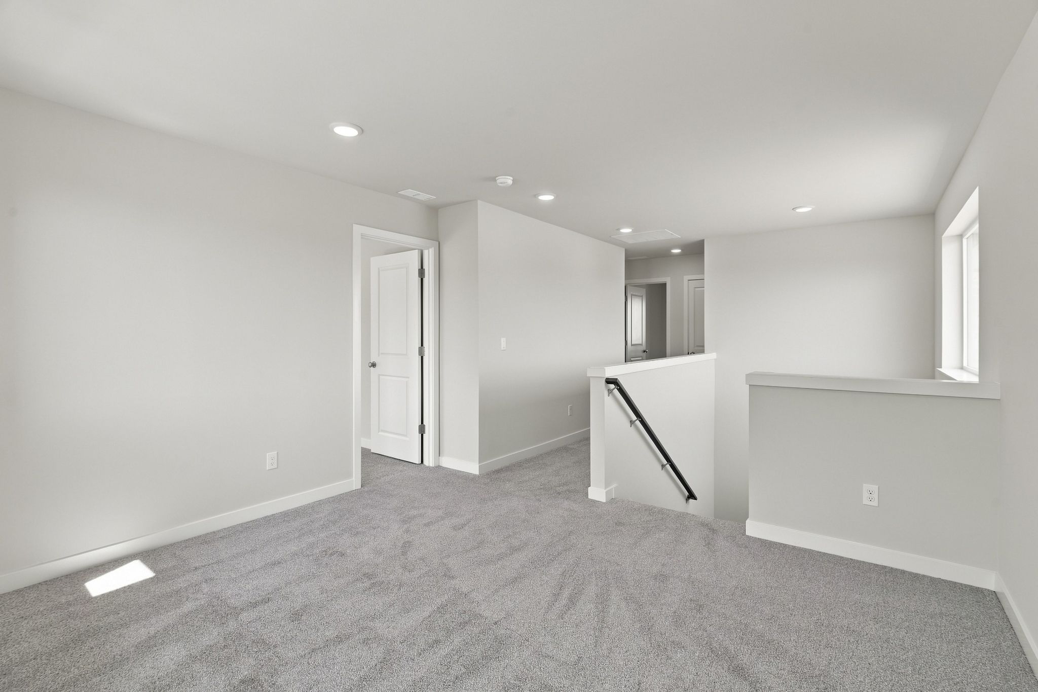 A room with a door and a window.