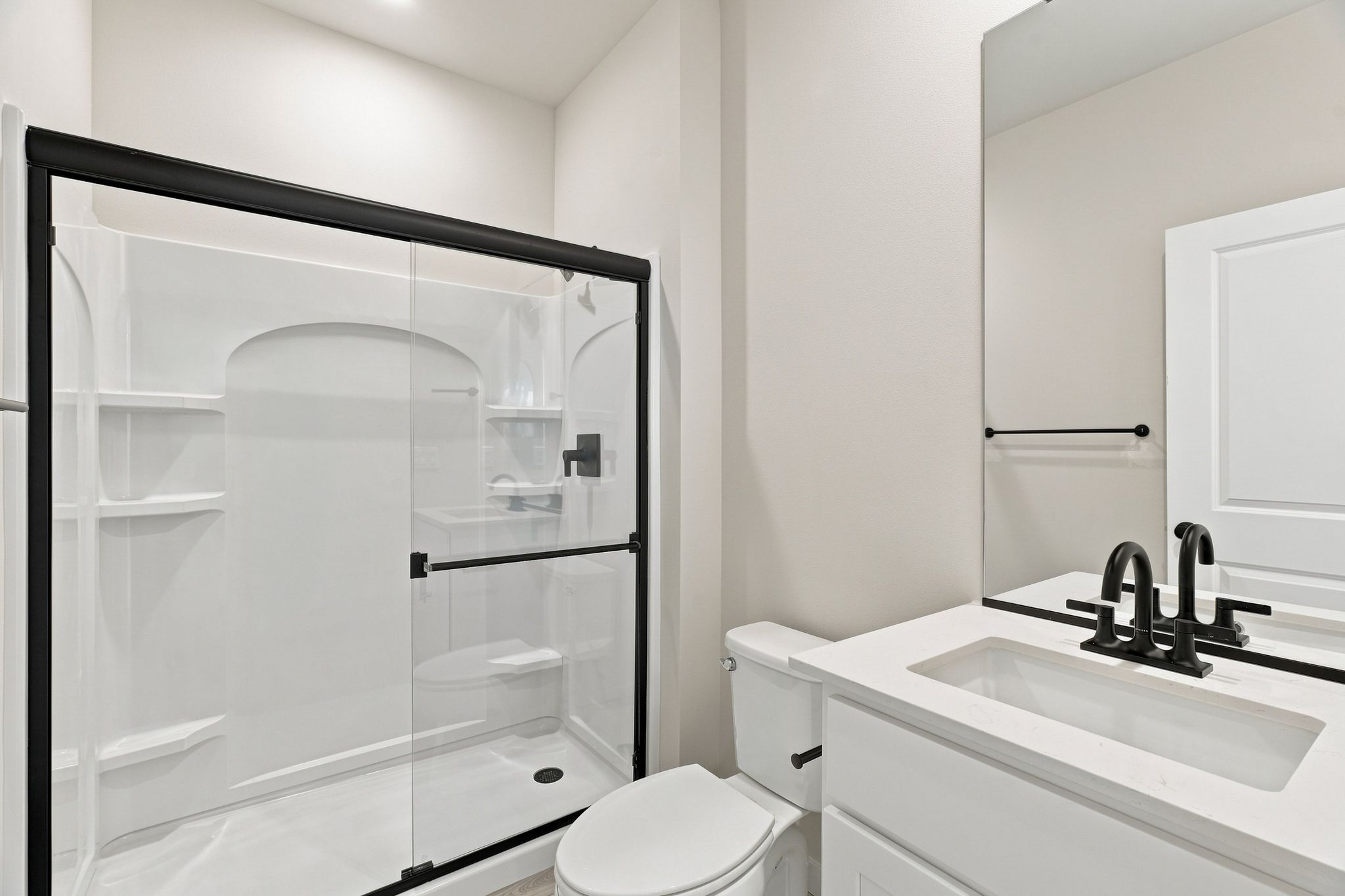 A bathroom with a glass shower.