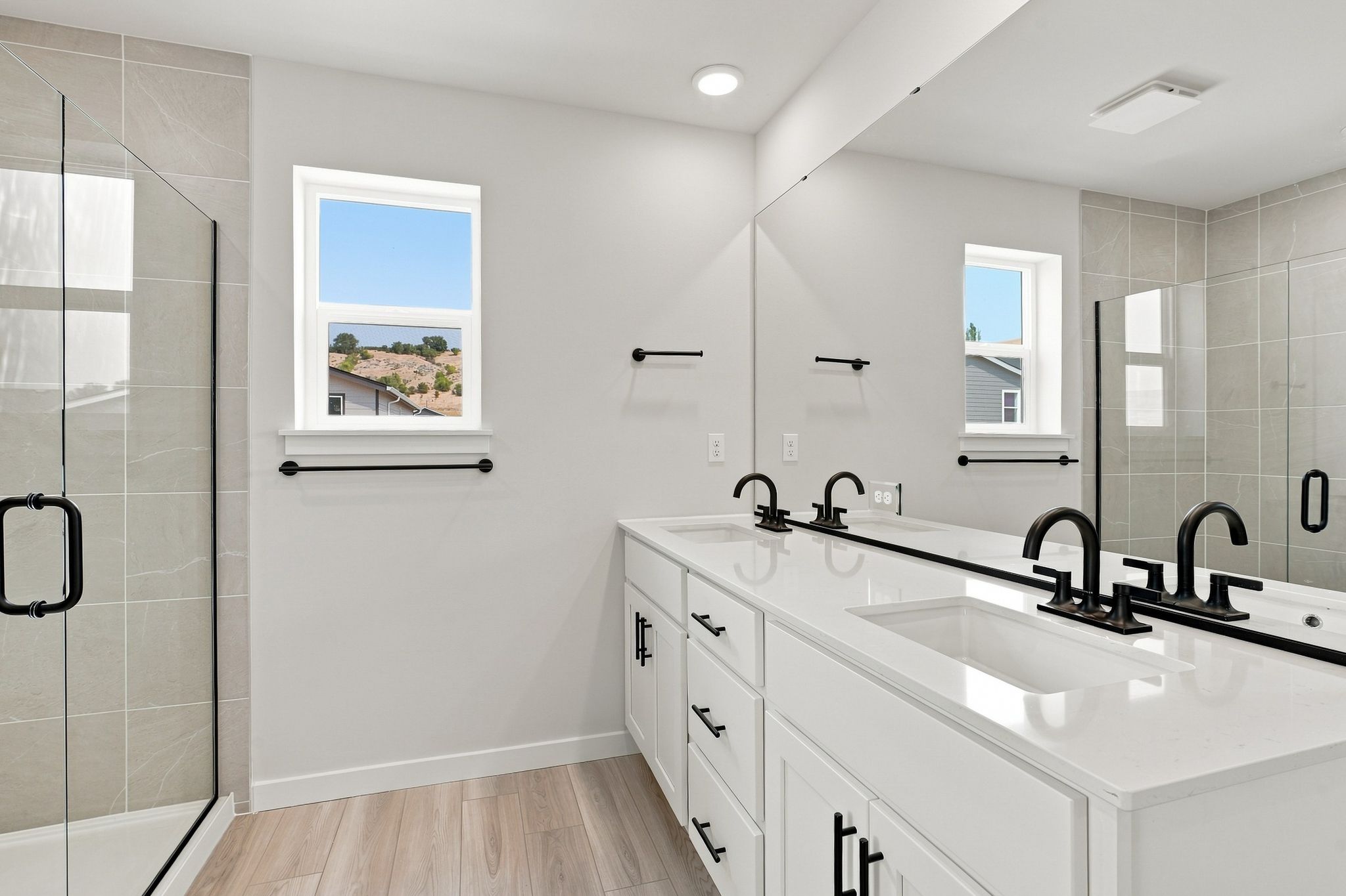A bathroom with a glass shower.