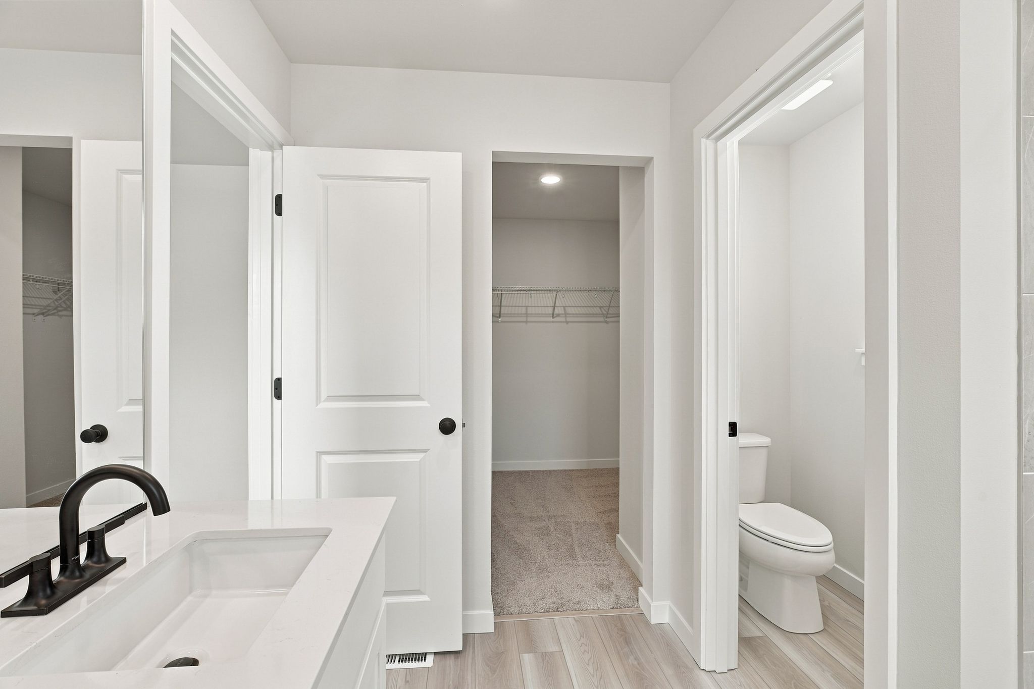 A bathroom with a sink toilet and shower.