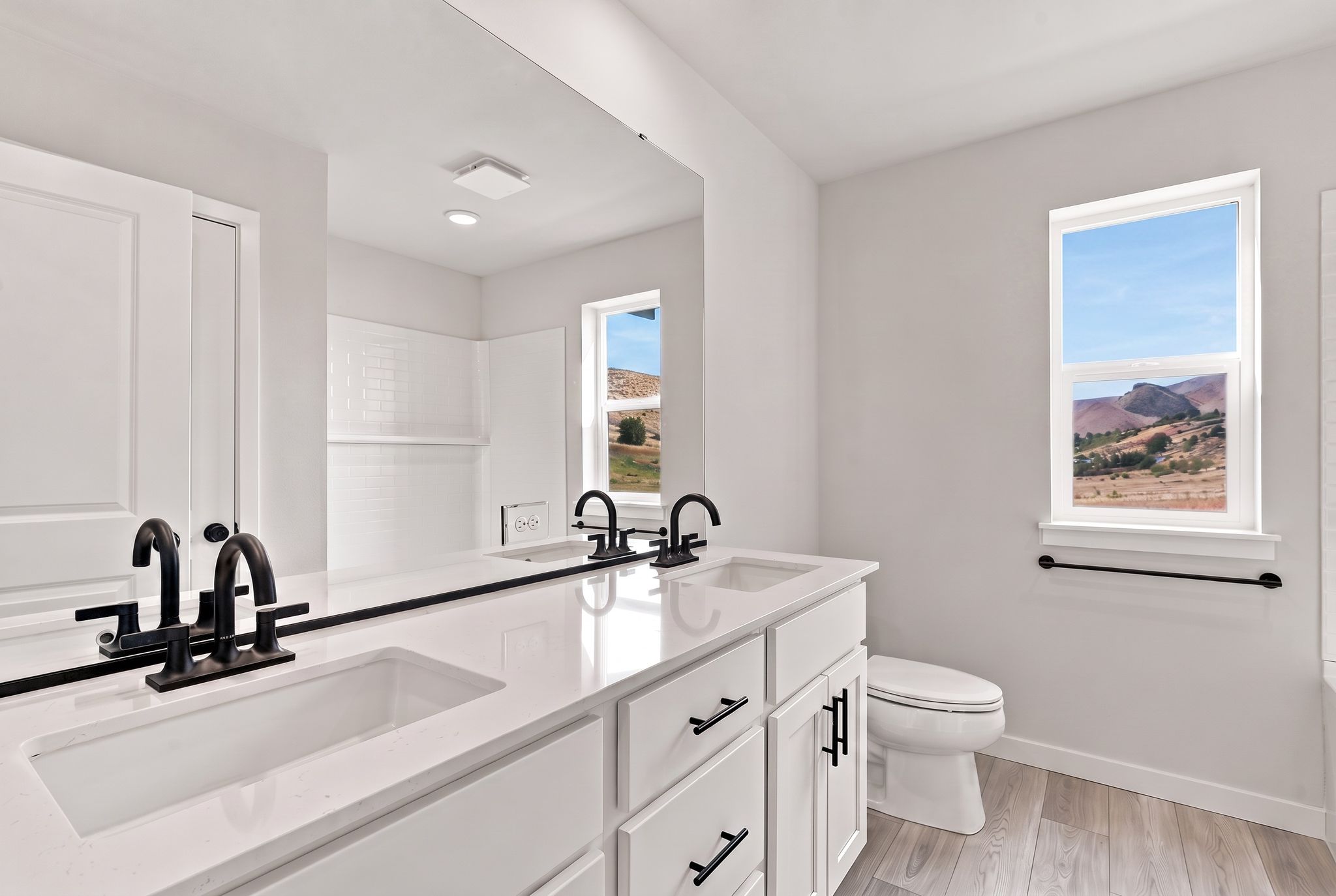 A bathroom with a large window.