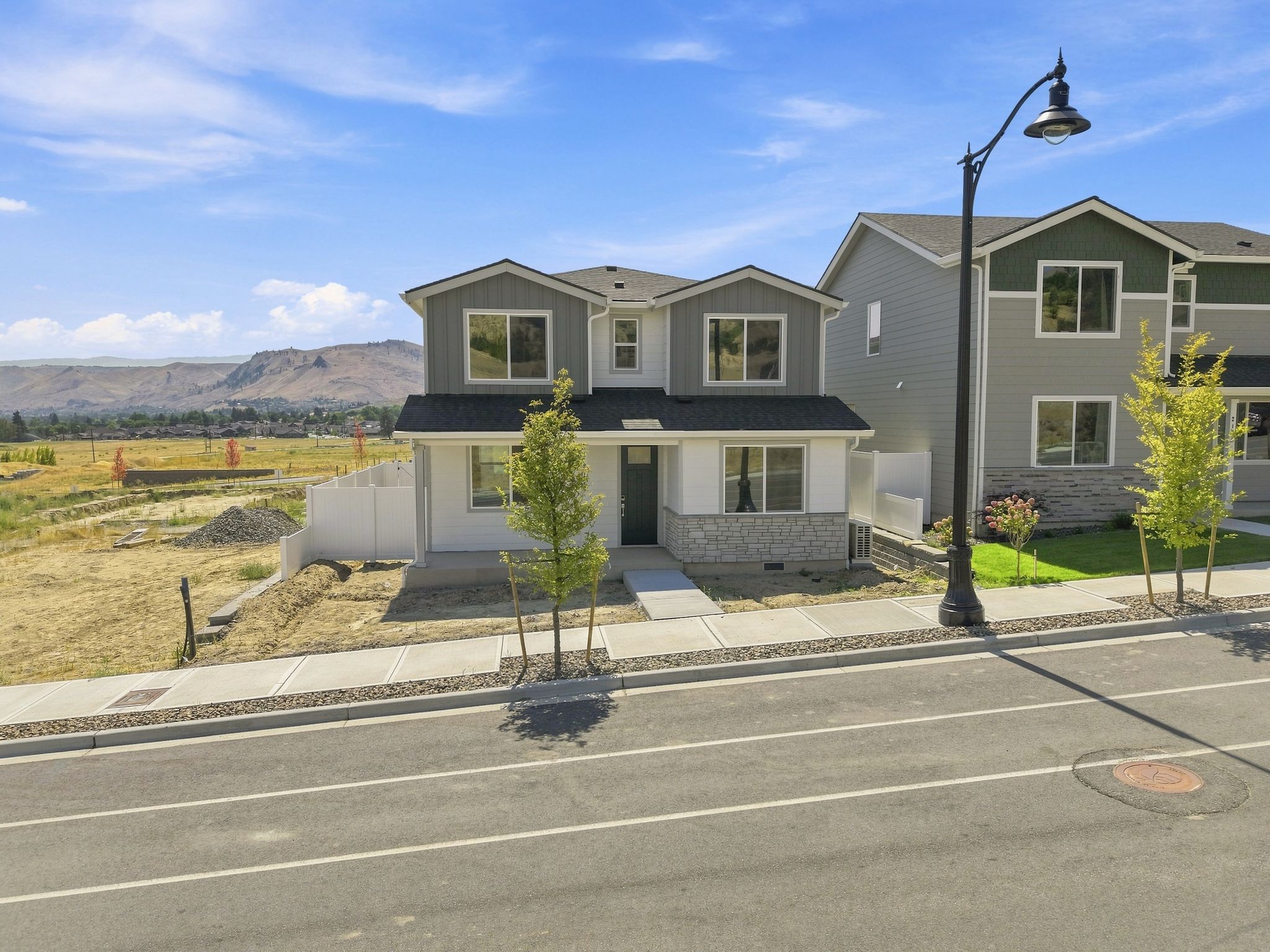 A large house with a parking lot.