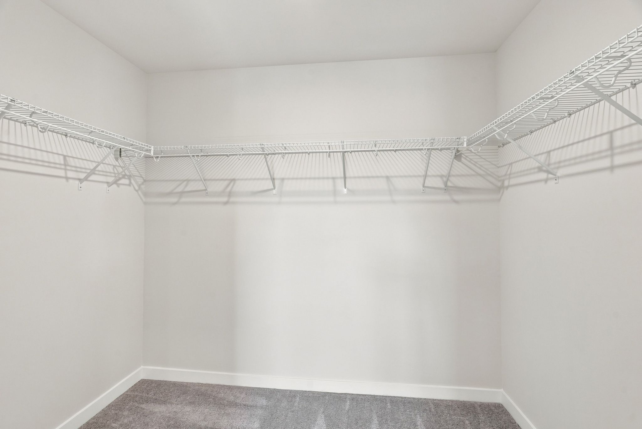 A white room with a staircase.