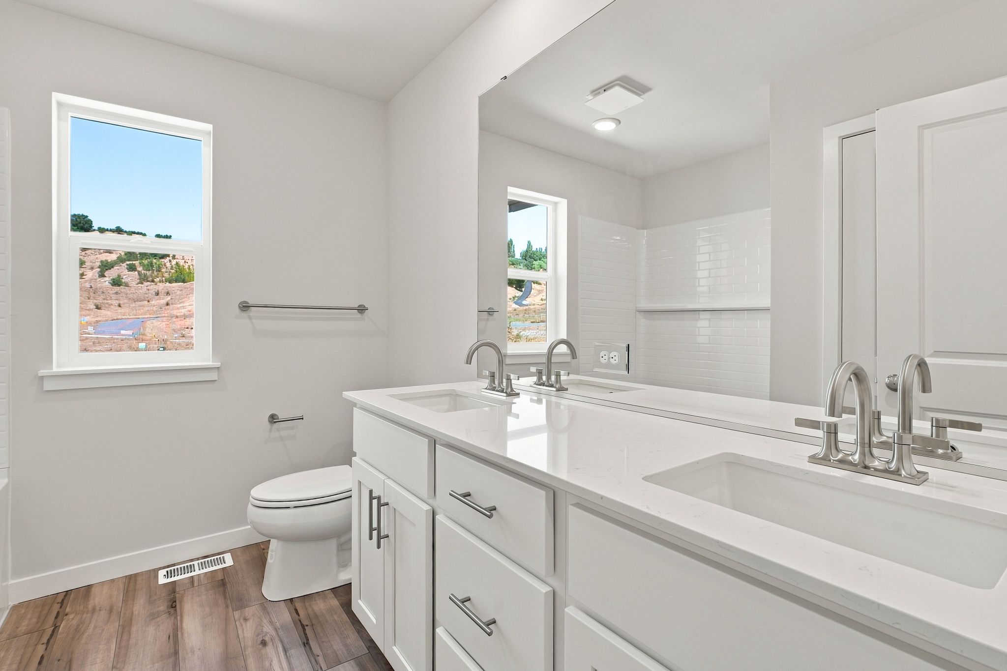 A bathroom with a tub sink and toilet.