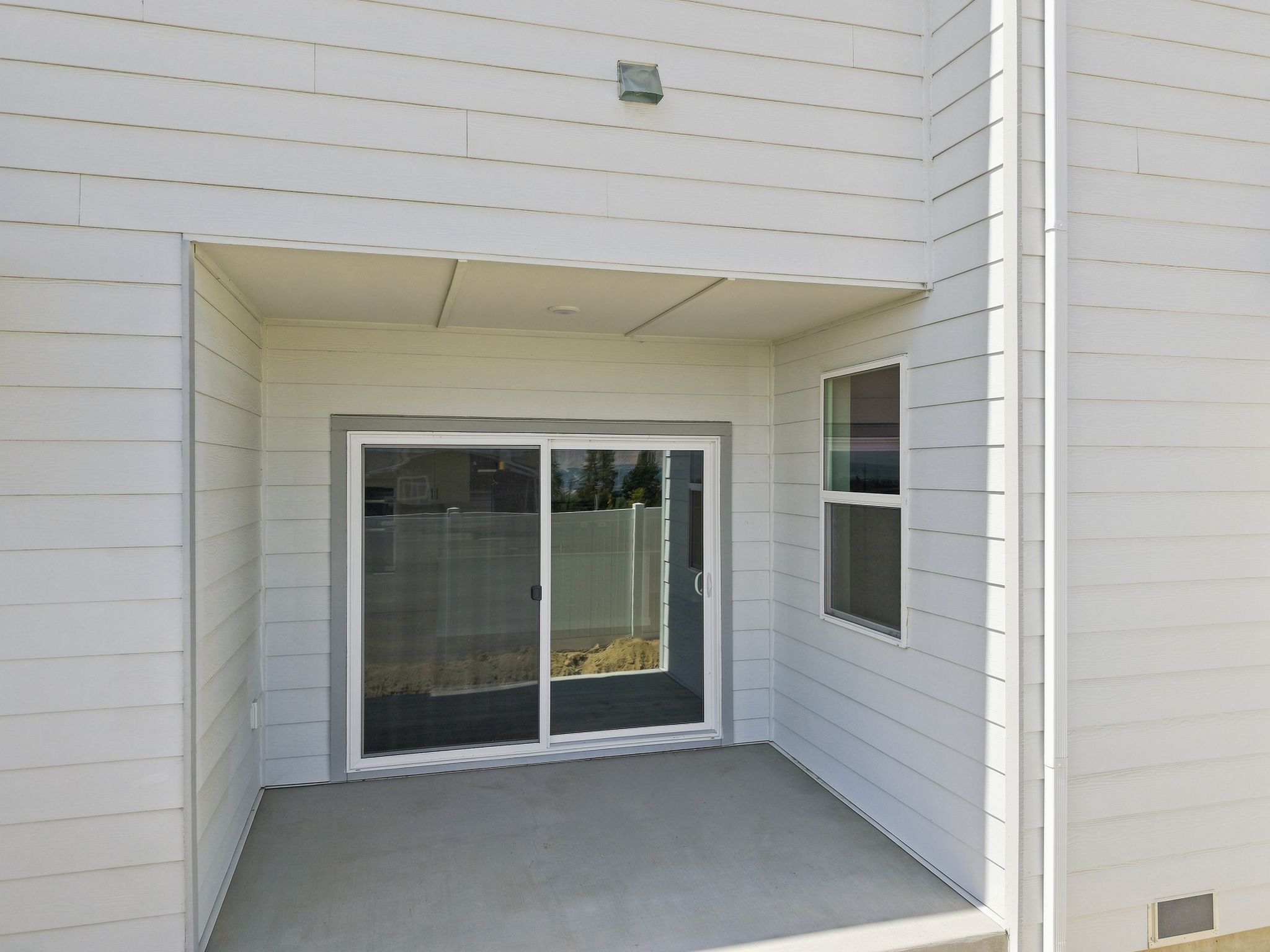 A white building with a window.