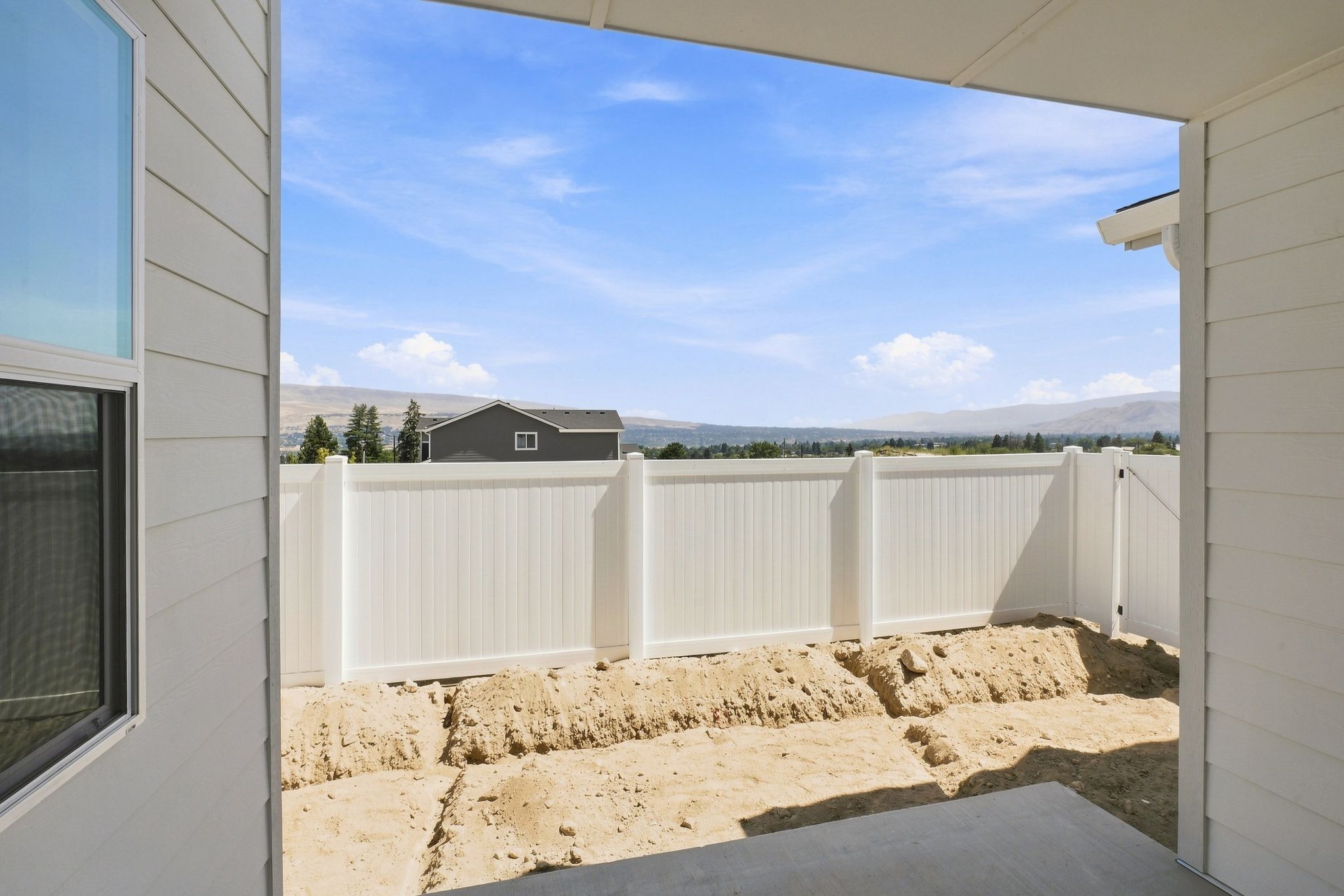 A white fence with a white gate.