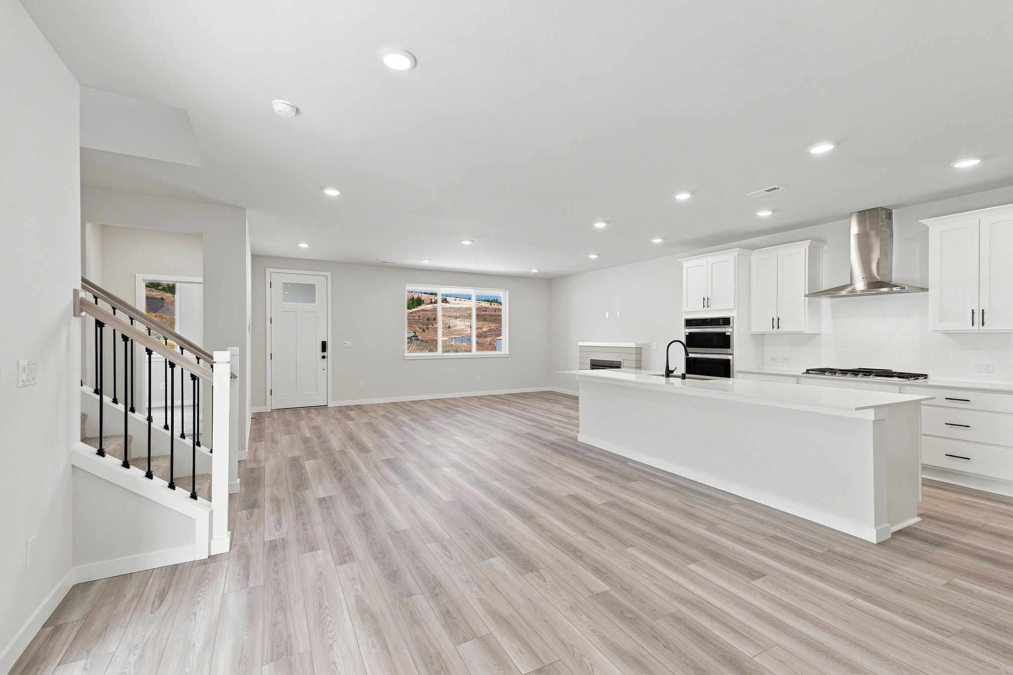 A large kitchen with white cabinets.