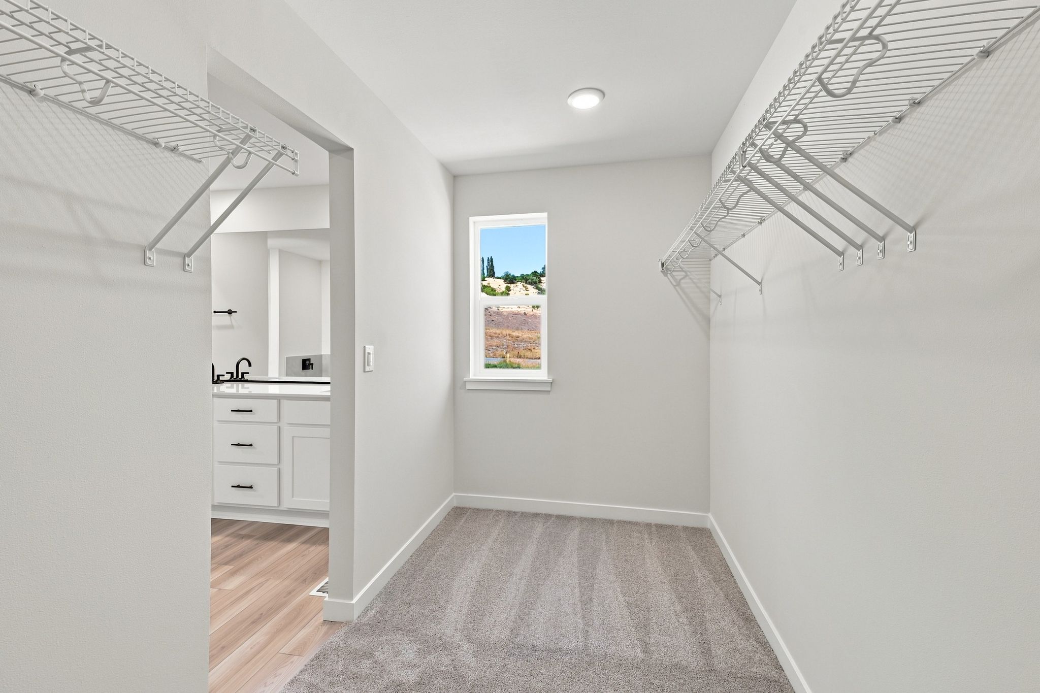 A hallway with white walls.