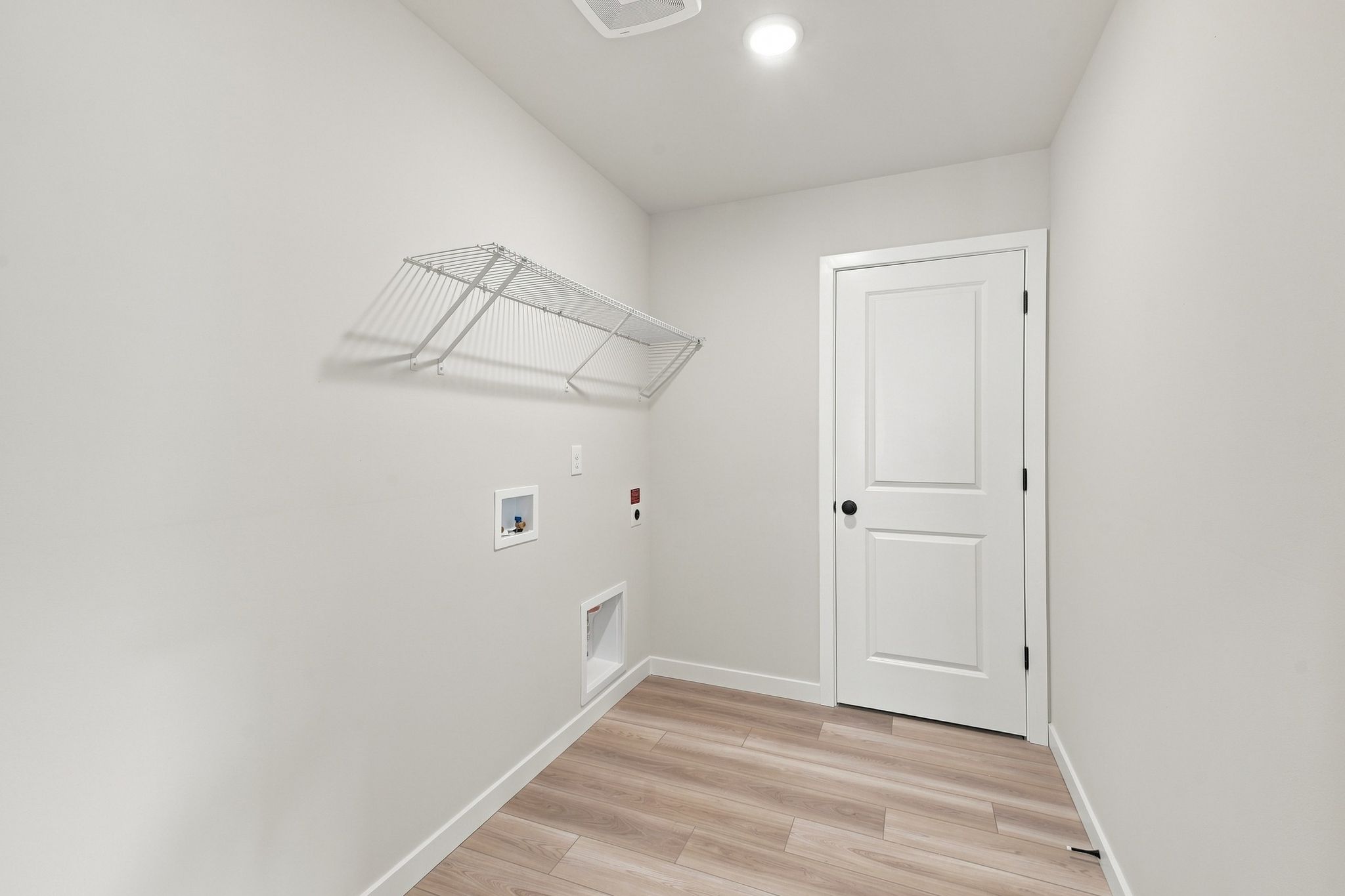 A room with a white door and a white door.