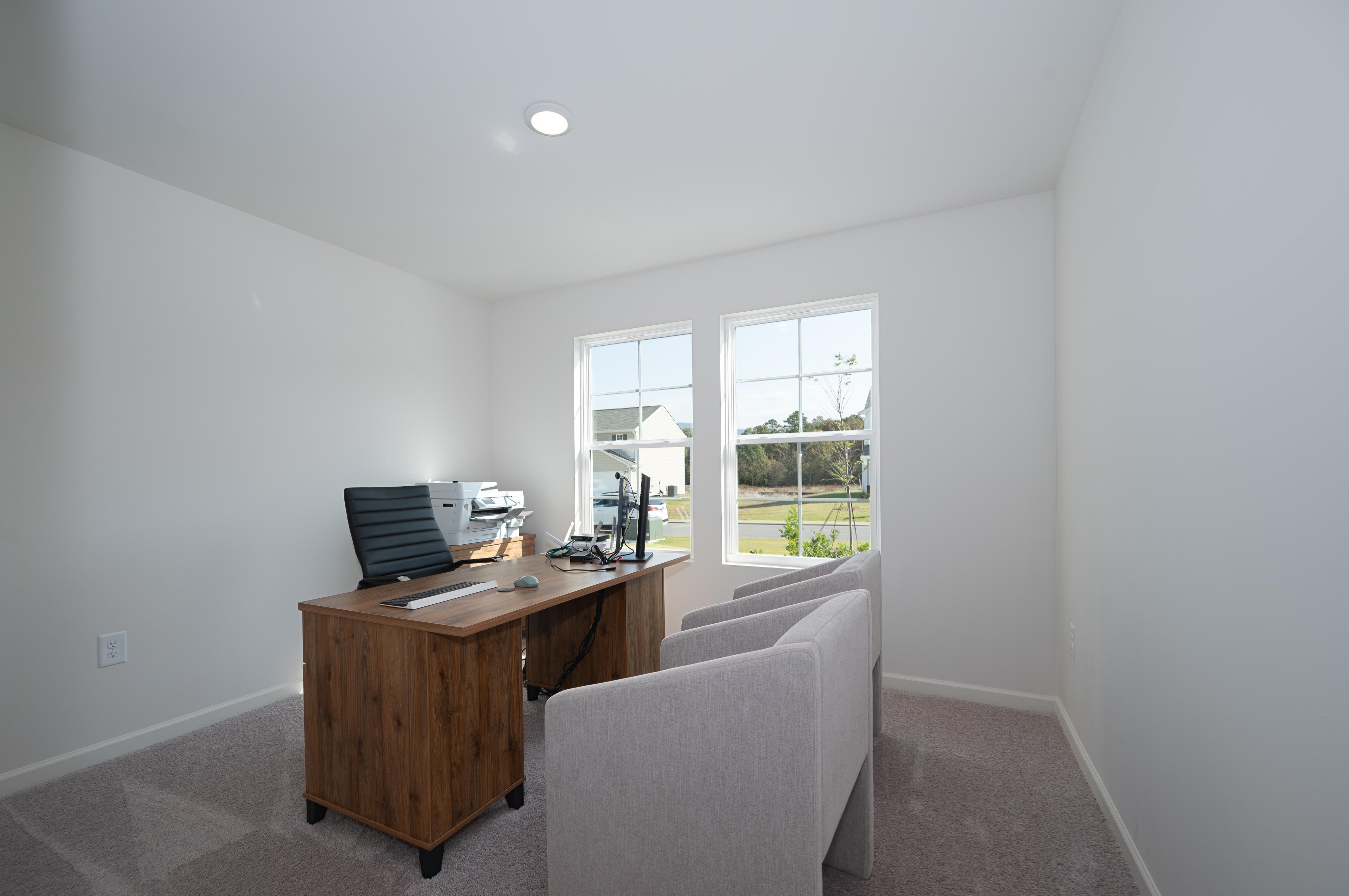 A room with a desk and chair.